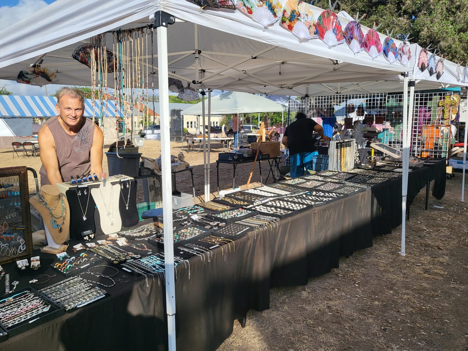 Shoppers browsing outdoor market stalls